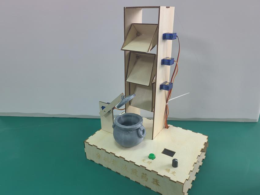 针对中药药性不同的全自动分批投放煎药器